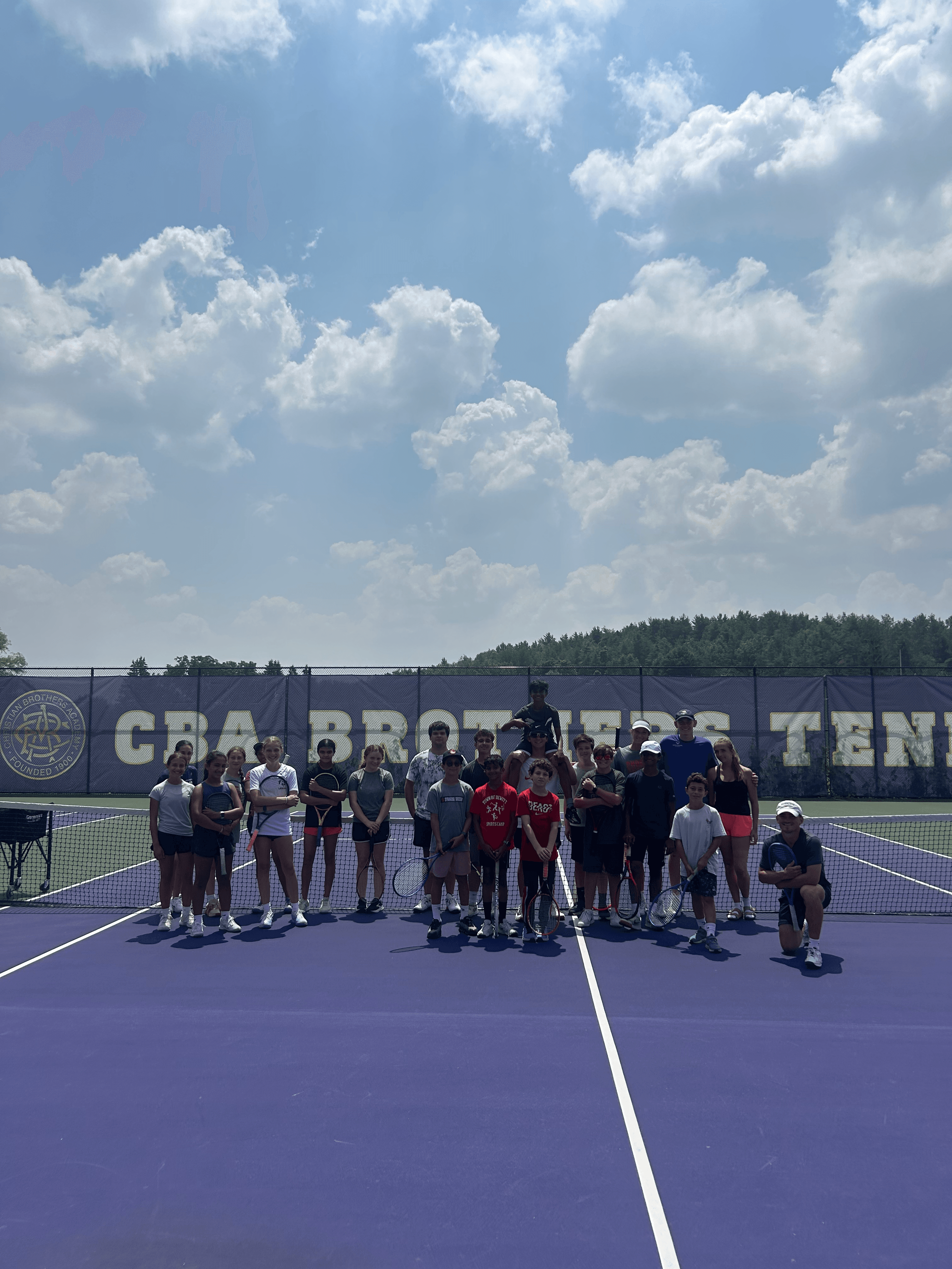 Peter Hatton coaching a tennis clinic in Syracuse NY